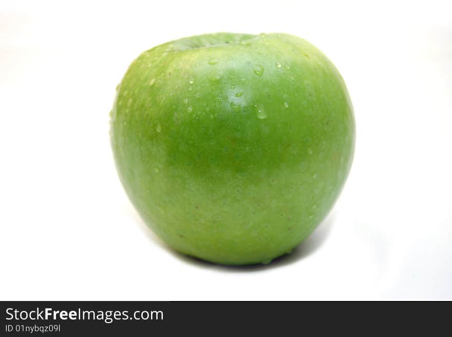 Wet green apple on white background