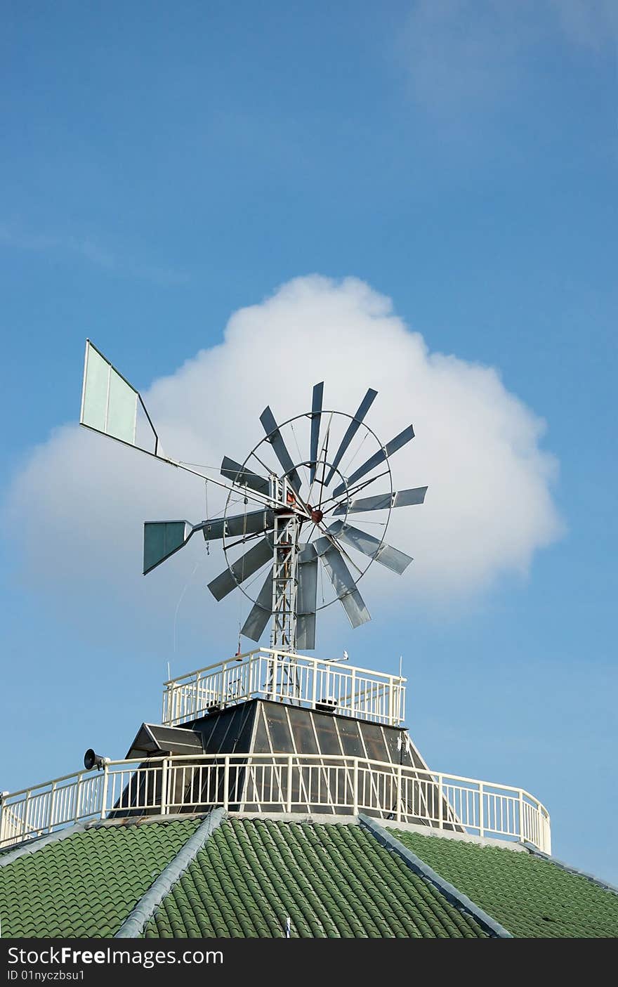 Big wind-mill on the roof top. Big wind-mill on the roof top