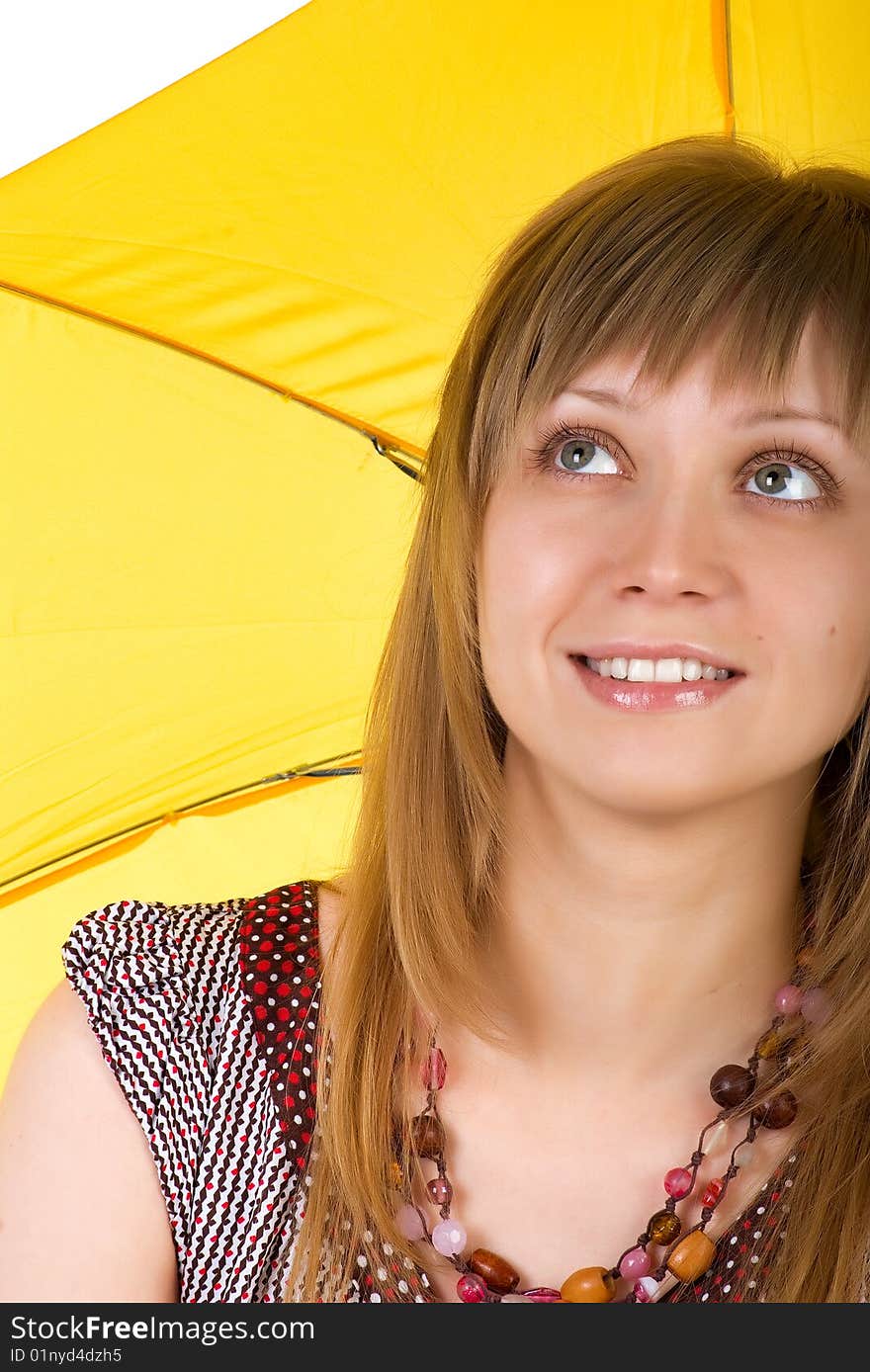 Cute young woman with yellow umbrella