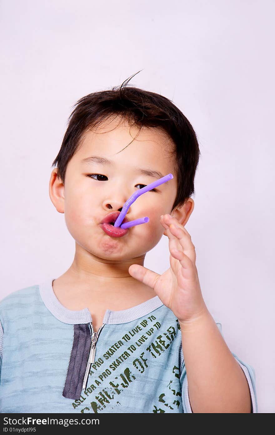 Boy Playing With Straw