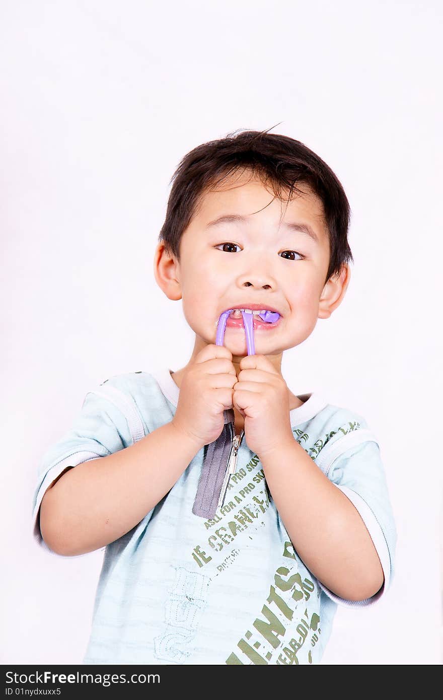 Boy playing with straw