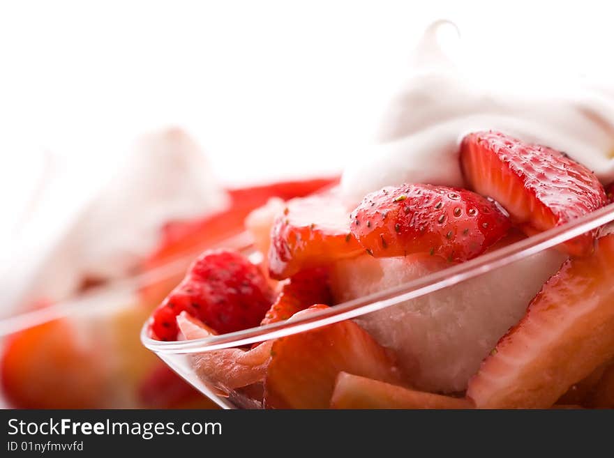 Strawberry shortcake in a martini glass sponge cake and whip cream