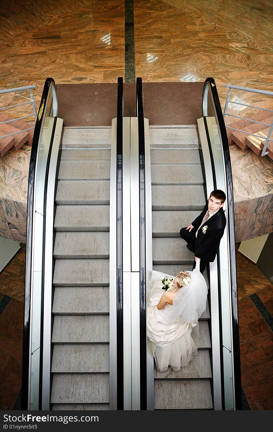 Bride and groom in metro