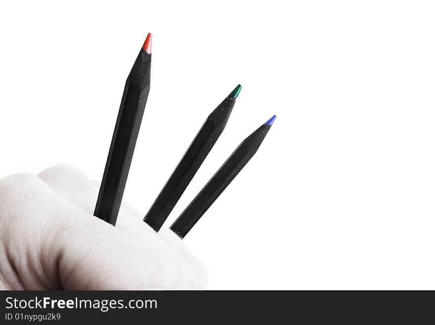 Feel creative power - fist holding sharp color pencils concept. Feel creative power - fist holding sharp color pencils concept