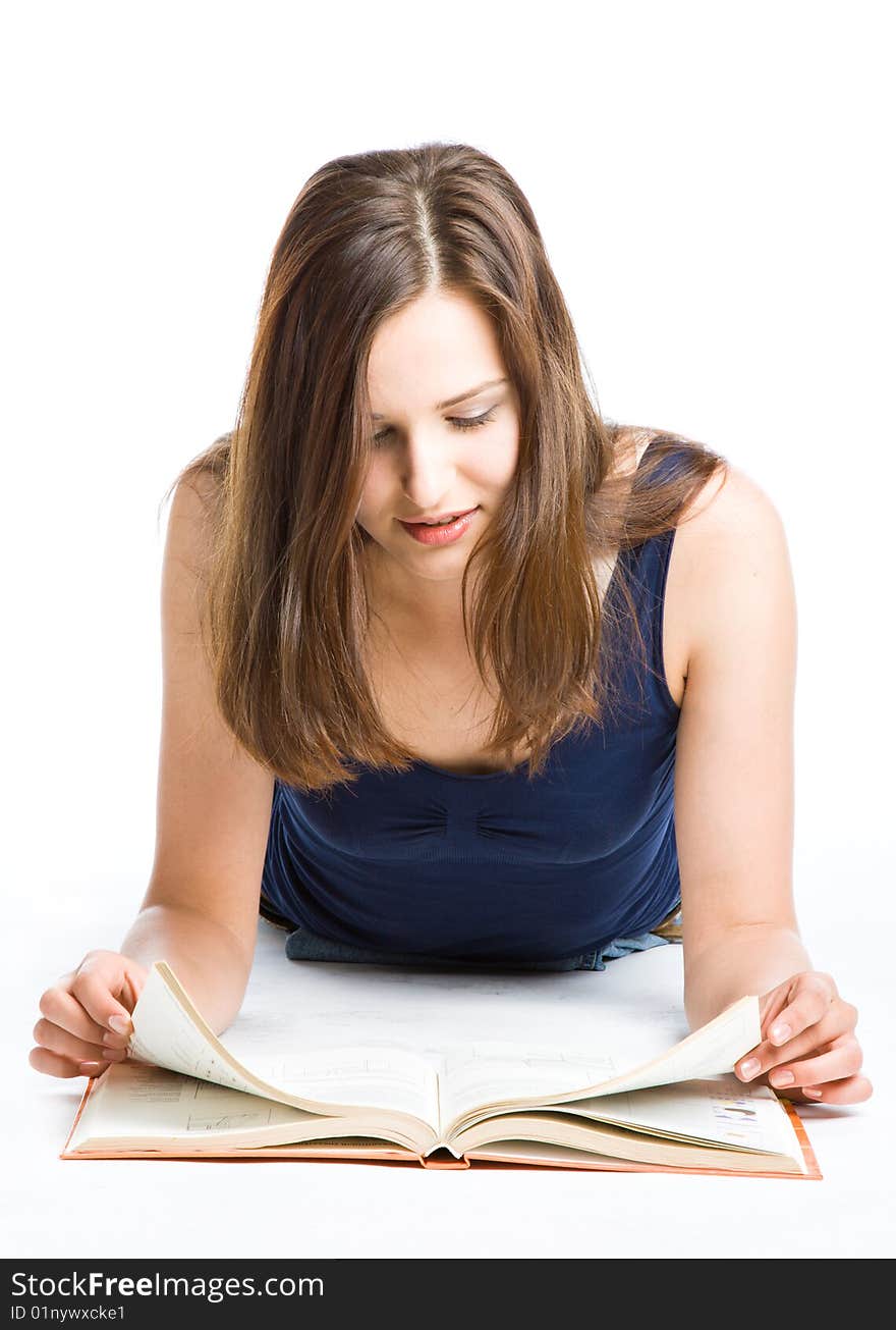 Girl laying on the floor and reading book