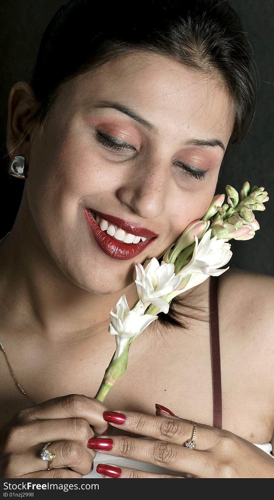 Smiling Girl With White Flowers