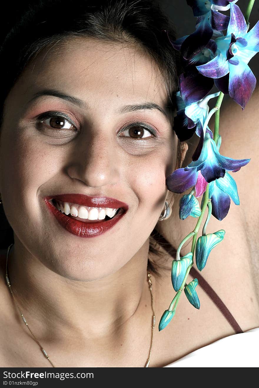 Smiling Girl With Voilet Flowers