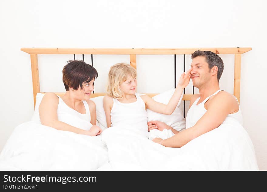 Young family three in a bed. Young family three in a bed