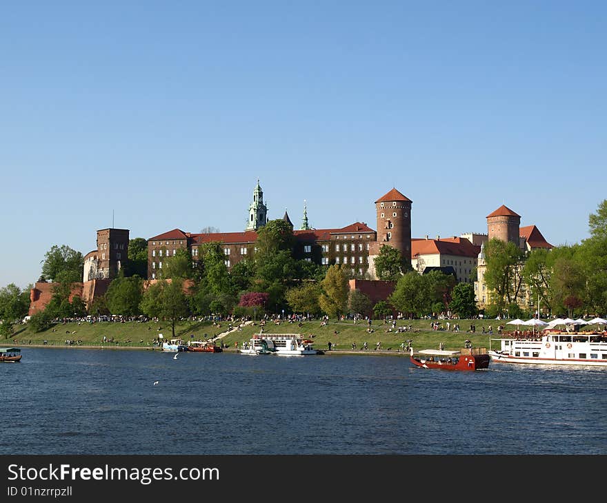 Wawel is an outcrop on the left bank of the Vistula River in KrakÃ³w, Poland. This is a place of great significance for the Polish people. The Royal Castle with an armoury and the Cathedral are situated on the hill. Polish Royalty and many distinguished Poles are interred in the Wawel Cathedral. Royal coronations took place there also. Wawel is an outcrop on the left bank of the Vistula River in KrakÃ³w, Poland. This is a place of great significance for the Polish people. The Royal Castle with an armoury and the Cathedral are situated on the hill. Polish Royalty and many distinguished Poles are interred in the Wawel Cathedral. Royal coronations took place there also.