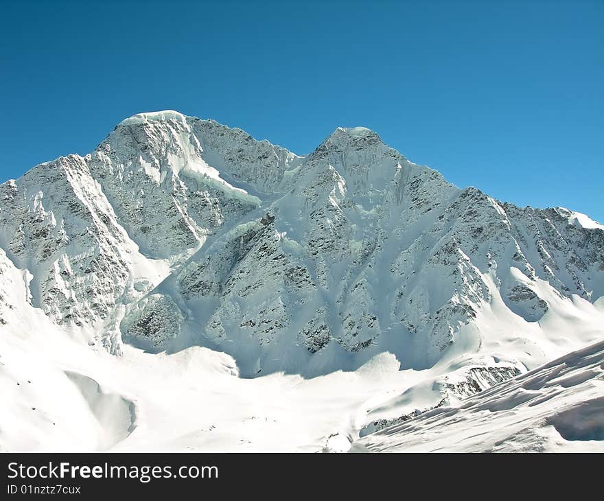 High in the mountains in winter on a clear day. High in the mountains in winter on a clear day