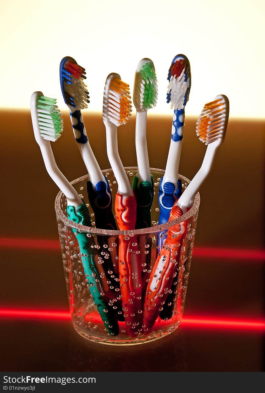 Toothbrushes in cup, studio shoot