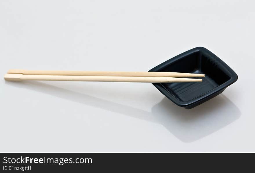 Chopsticks and a wasabi dish