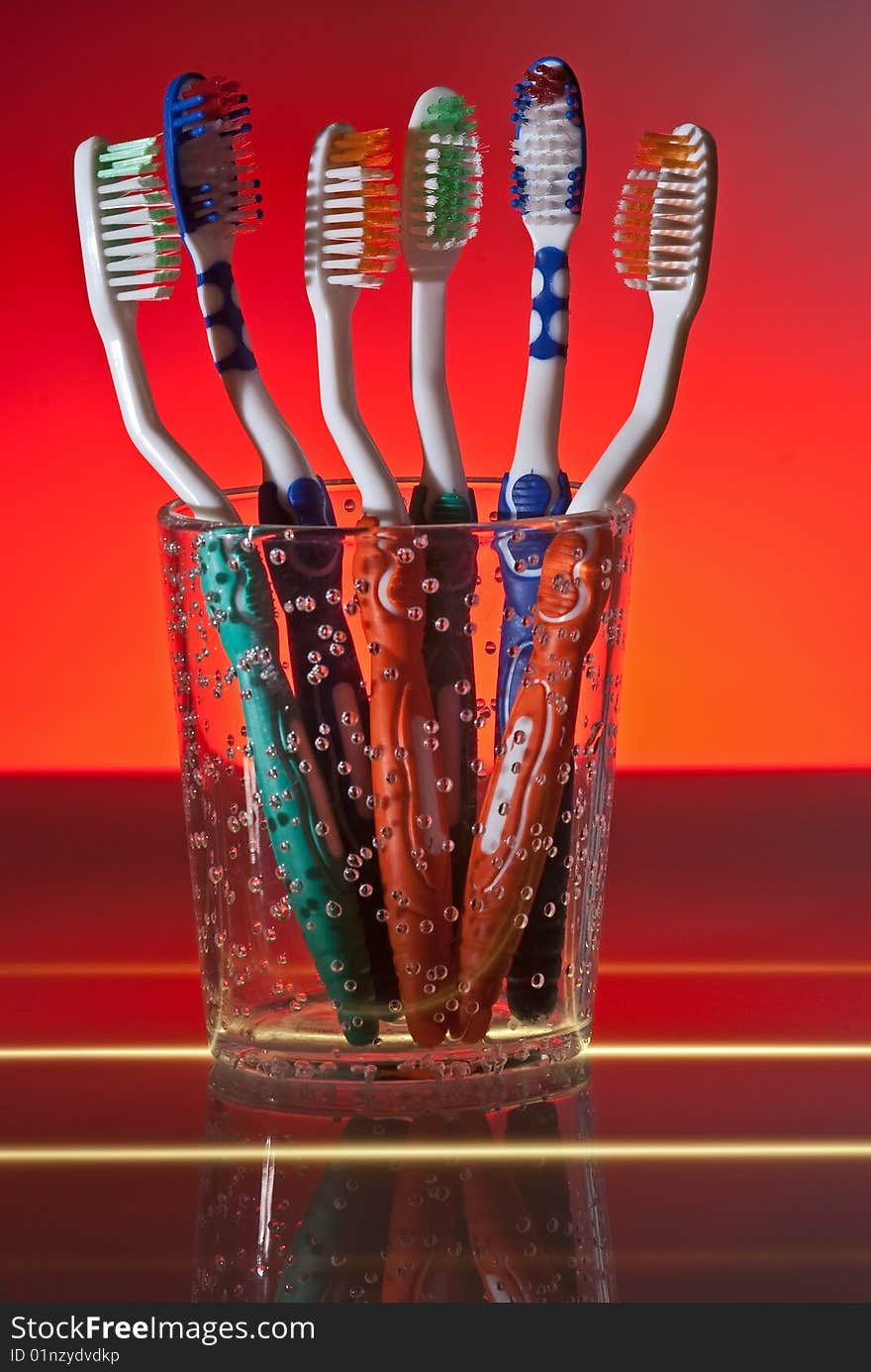 Toothbrushes in cup, studio shoot