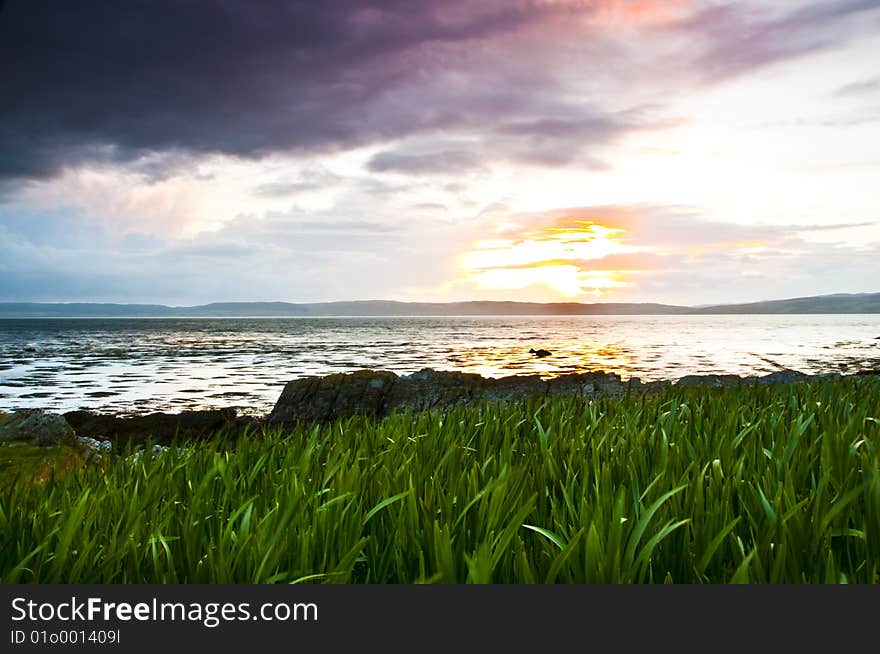 Sun set over lockranza with grass in the foreground