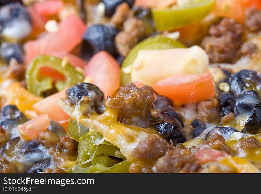 Plate of nachos shot close up nice detail of the freshly cooked vegetables