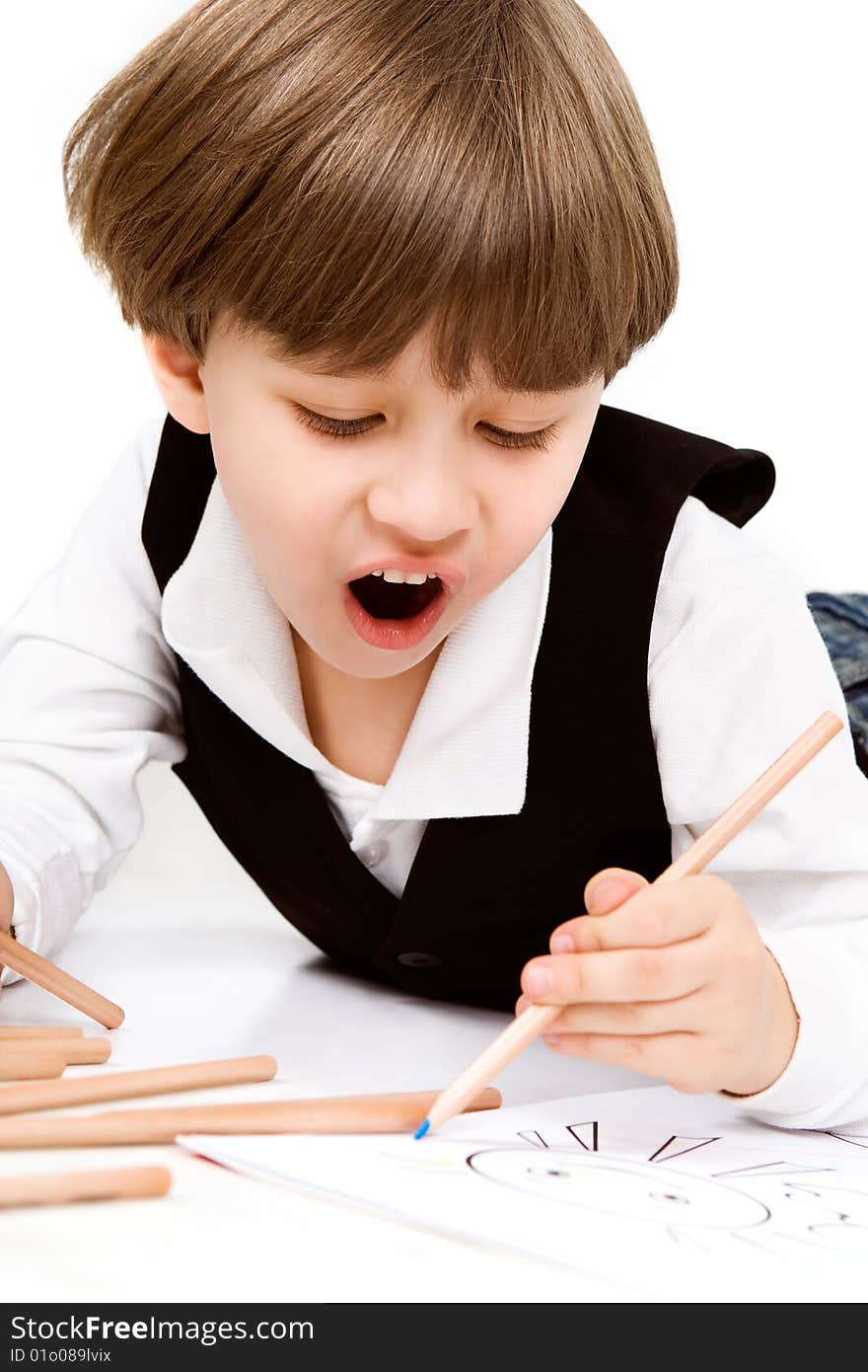 Adorable little boy with pencil