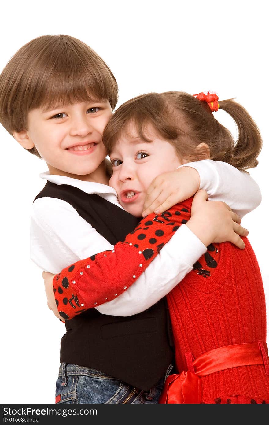 Adorable little boy hugging his sister