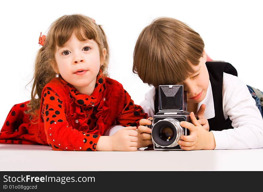 Adorable children taking pictures with photo camera. Adorable children taking pictures with photo camera