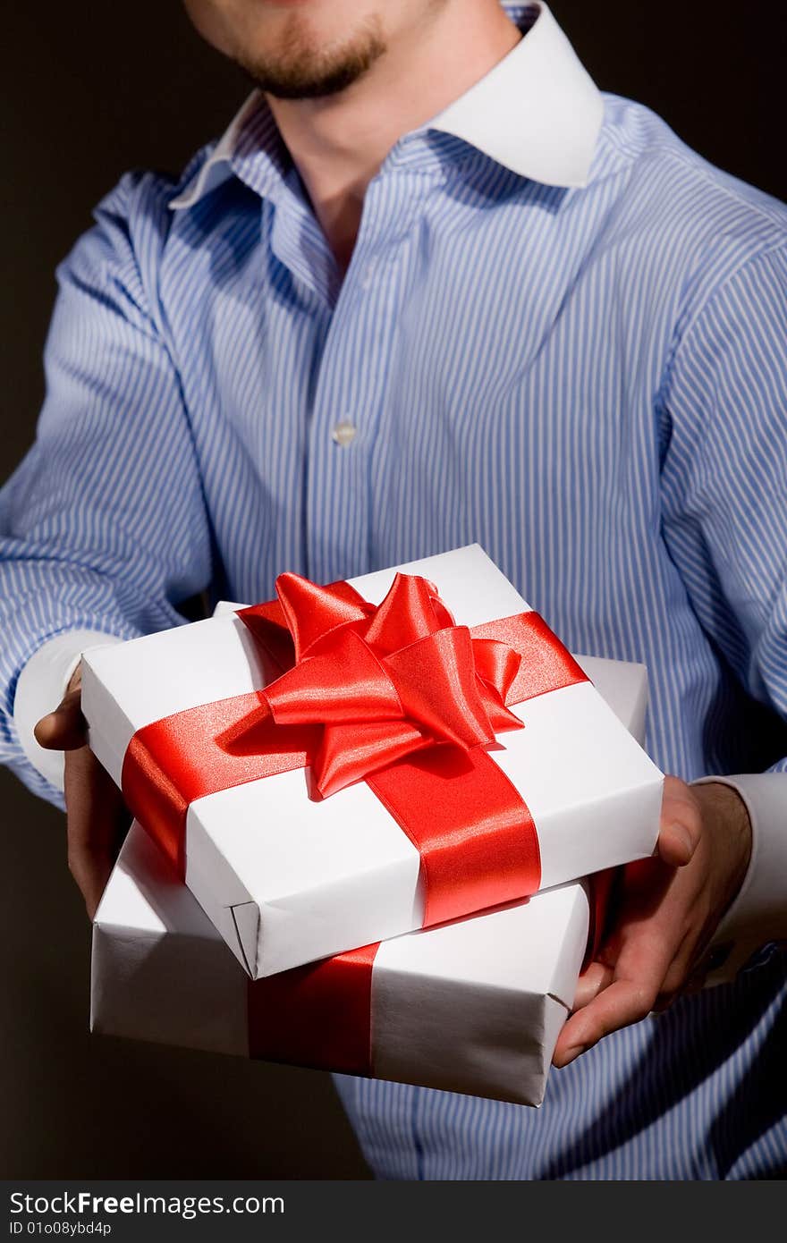 Man holding fine wrapped gift box