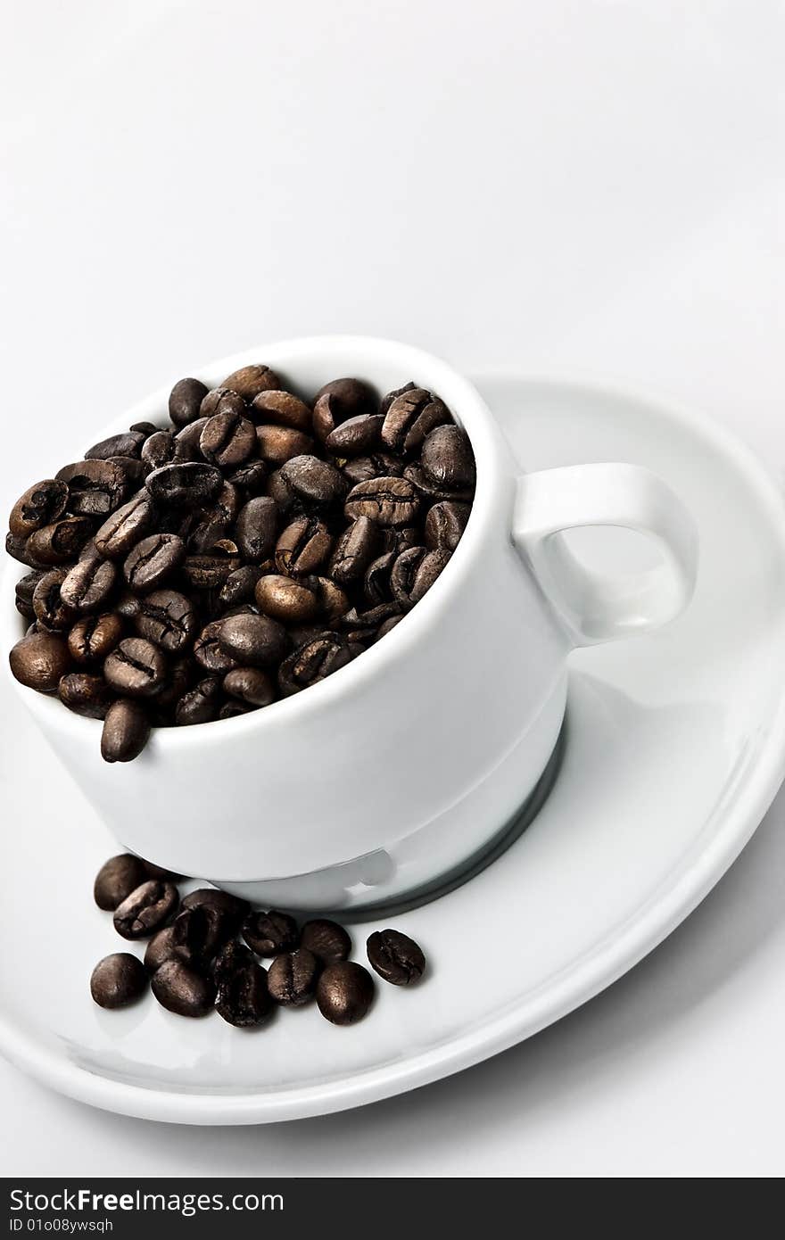 Coffee Beans In A Coffee Cup