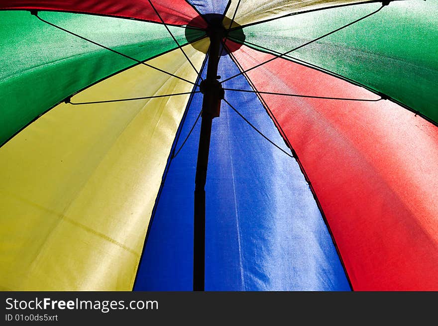 An umbrella under the sunny sky. An umbrella under the sunny sky