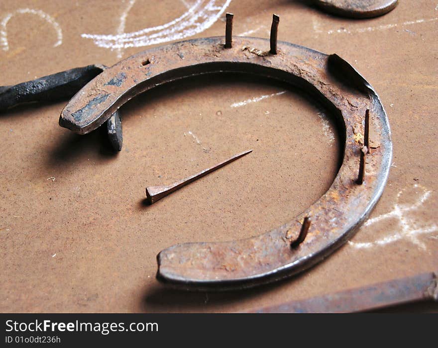 Horseshoe on a metalic table. Horseshoe on a metalic table.