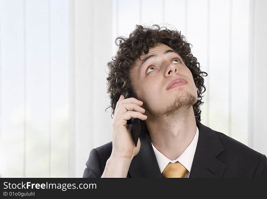 Business man with mobile phone in the office