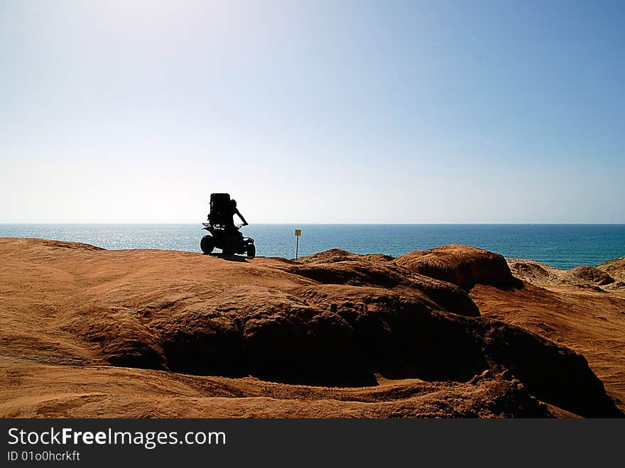 Adrenalin driving. Dune Buggy riding on a sea cliff. Adrenalin driving. Dune Buggy riding on a sea cliff.