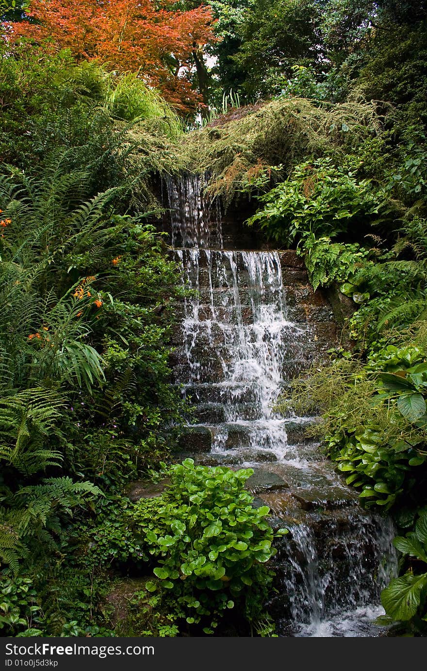 Stream flowing over rocks and down a bank. Stream flowing over rocks and down a bank