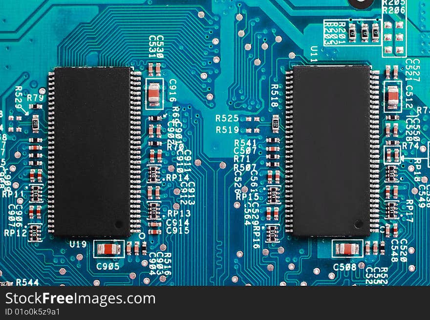 Power of technology: two chips on blue circuit board