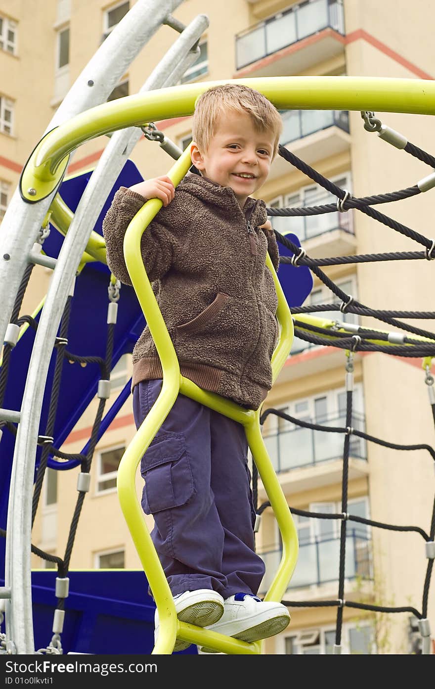 Toddler on climbing frame