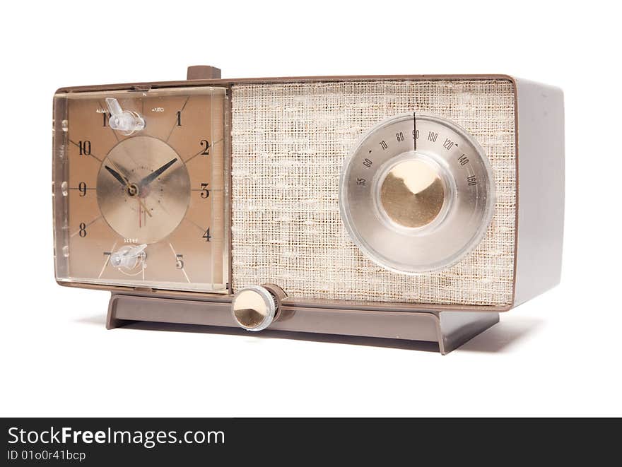 Vintage Clock Radio Facing Left Isolated on a White Background. Vintage Clock Radio Facing Left Isolated on a White Background.