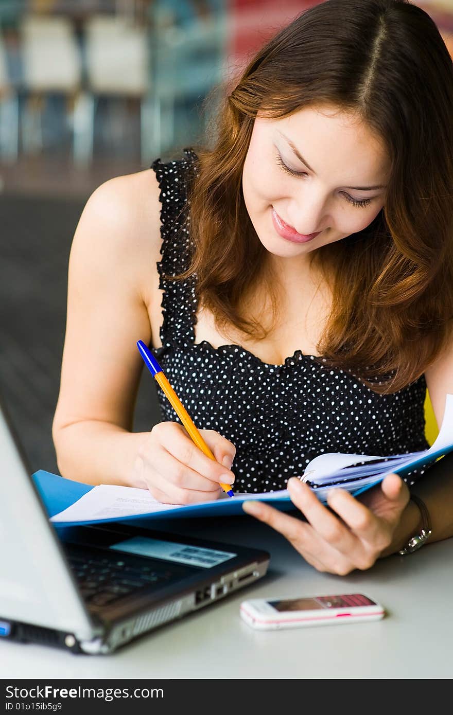 Young pretty caucasian lady using laptop outdoors