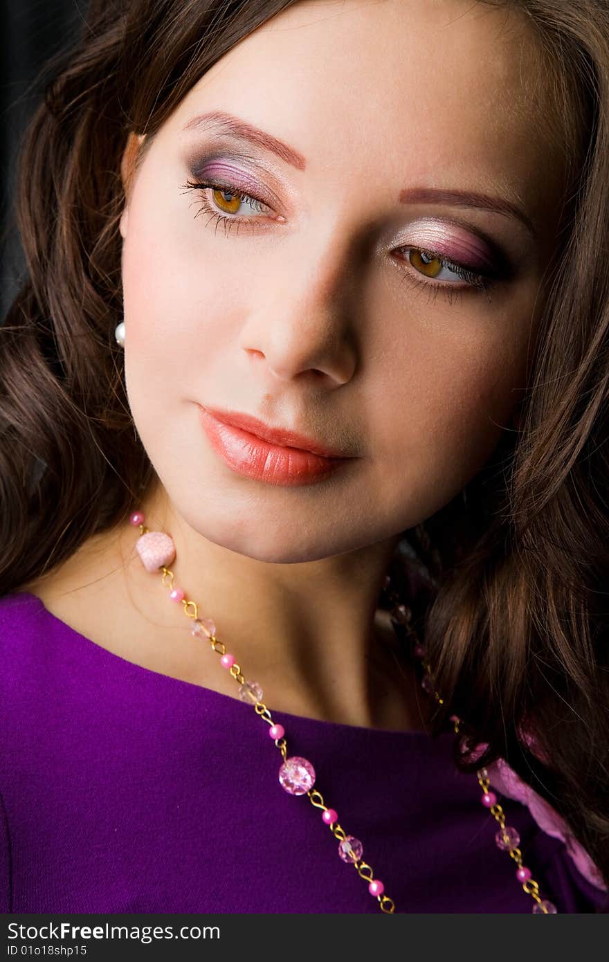 Face of beautiful girl with beads