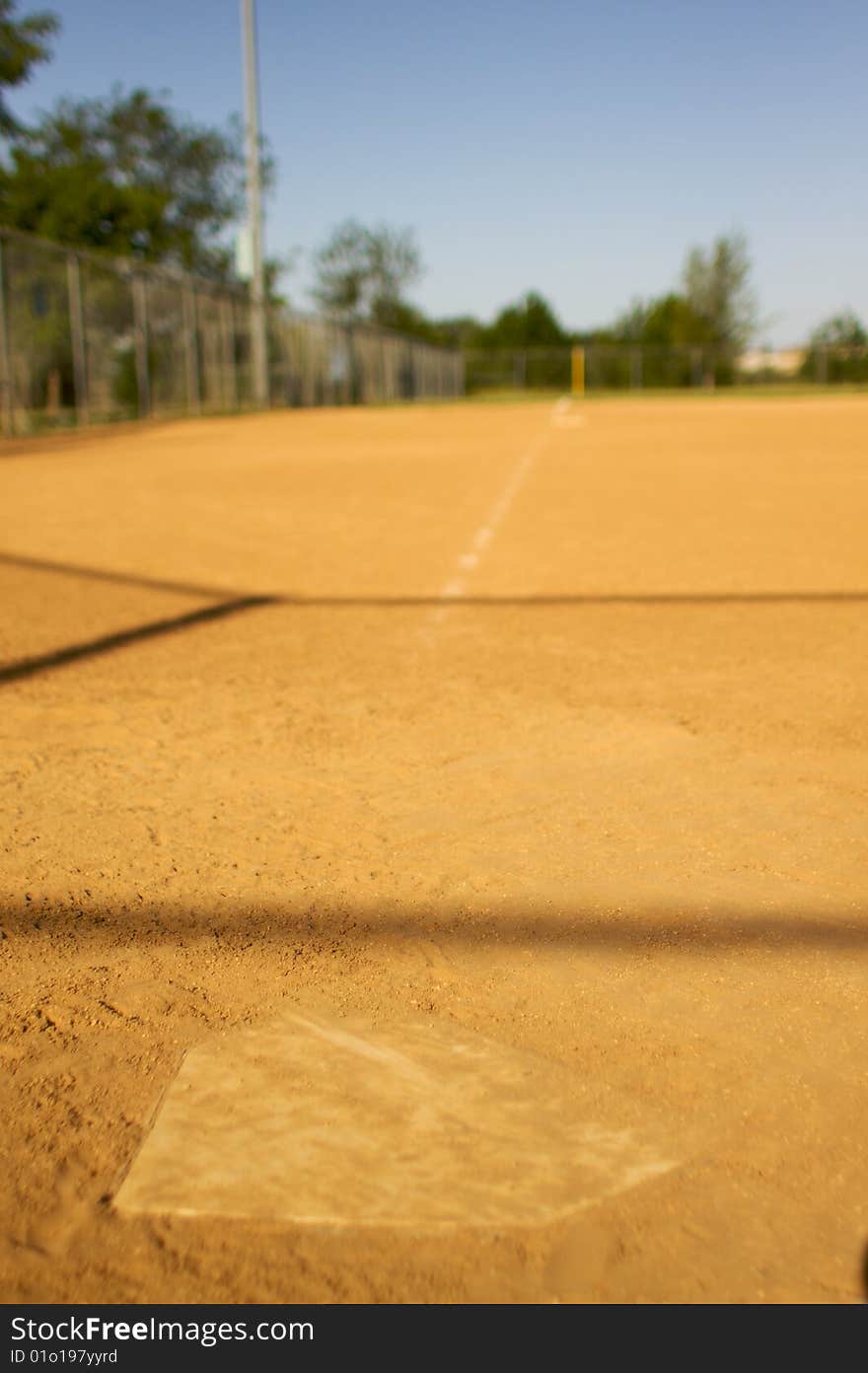 Short depth of field shot of home plate looking towards third base