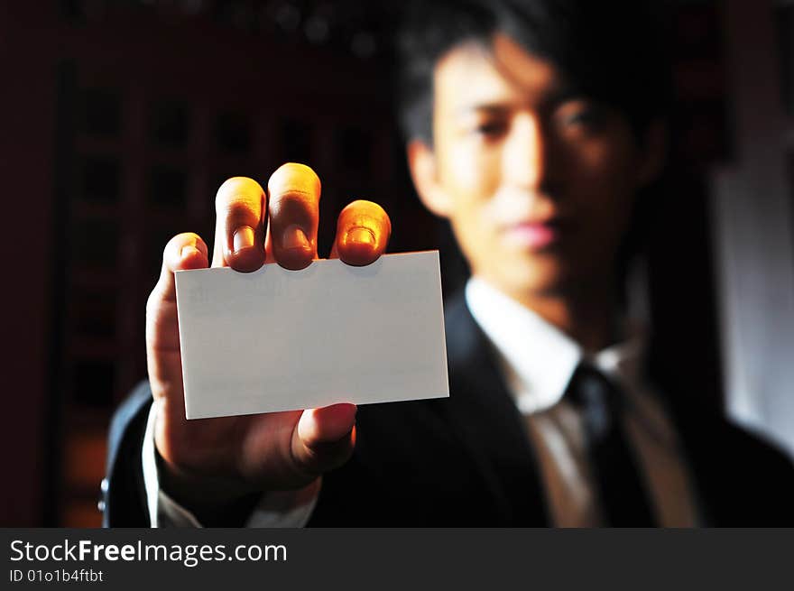 Smart Asian man in business suit in chinese temple. Smart Asian man in business suit in chinese temple