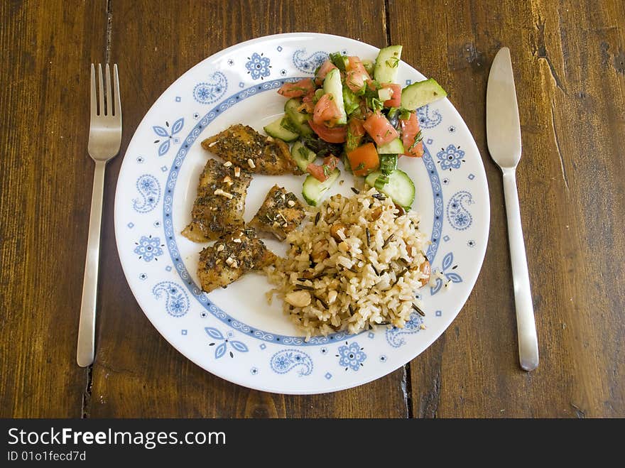 Plate with marinaded fish and garnish