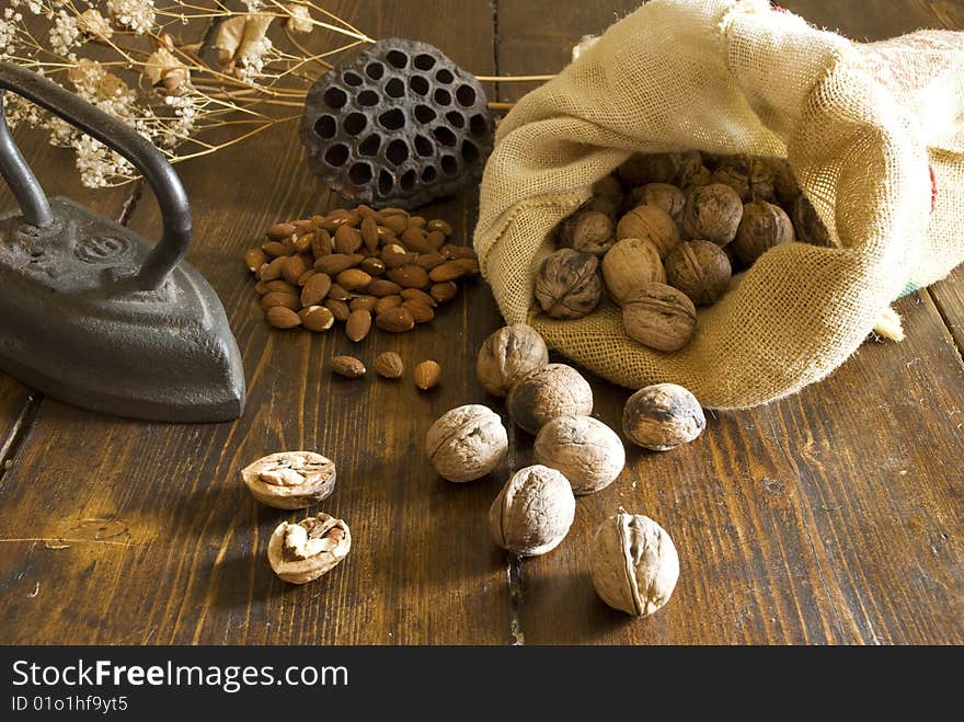 Walnuts with almond on woof table