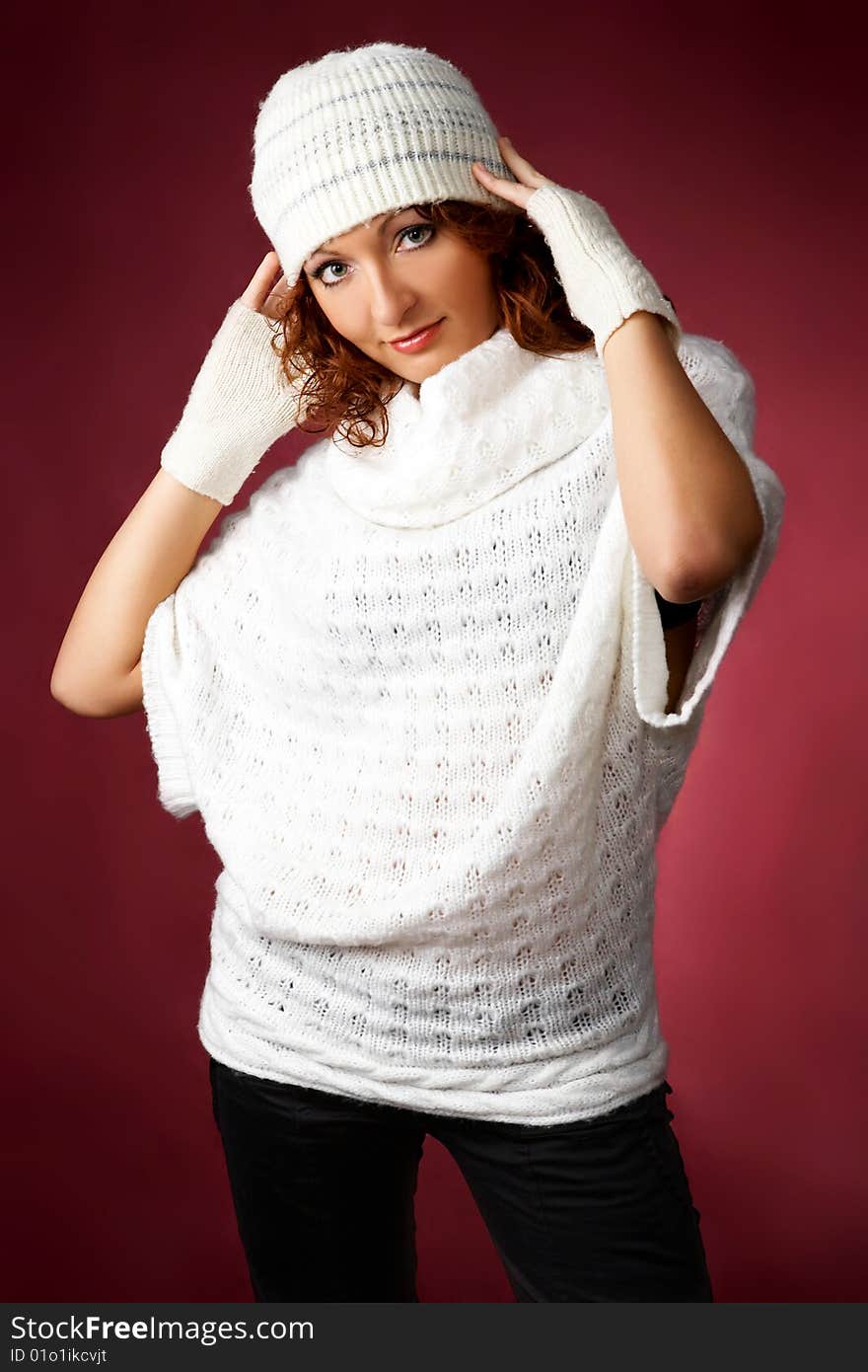 Sexy woman on a red background in a studio