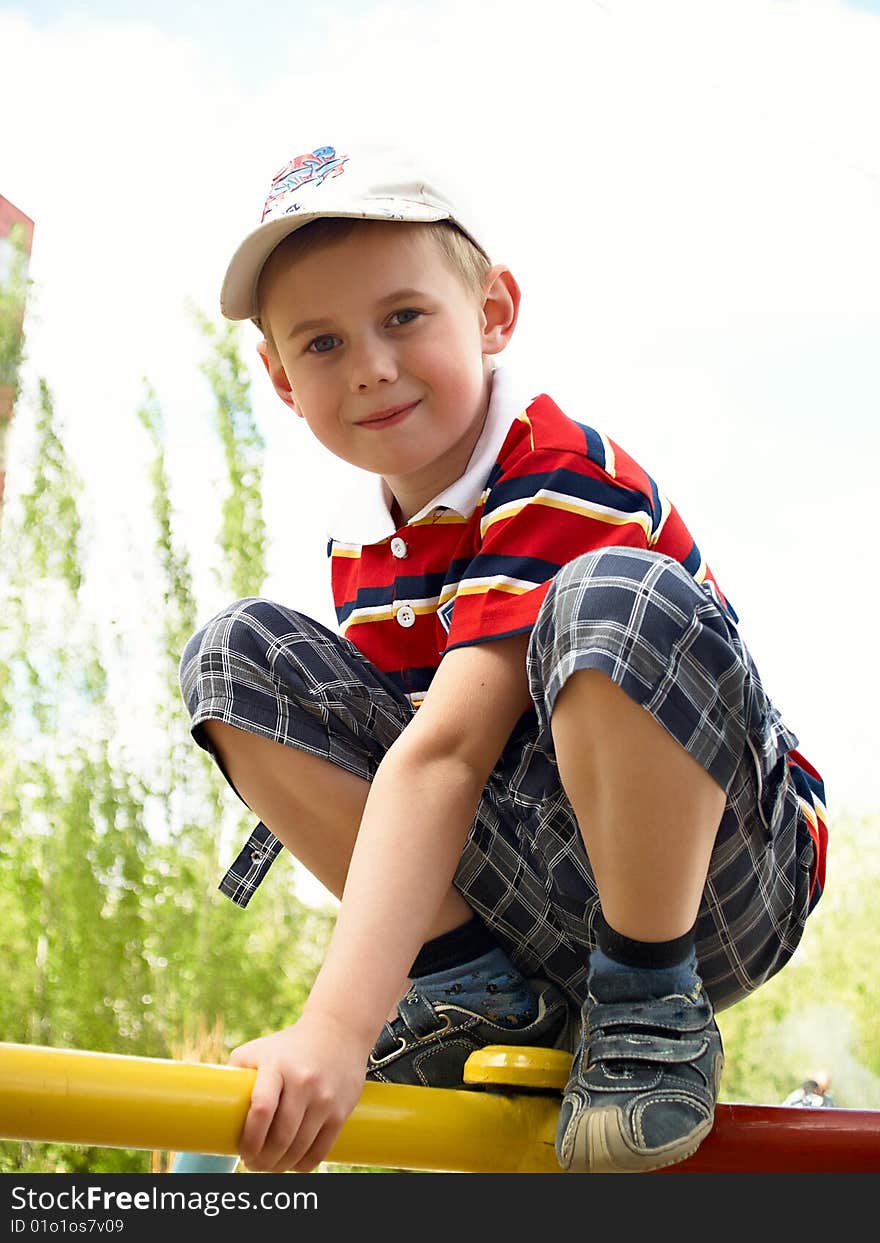 The boy plays in the street