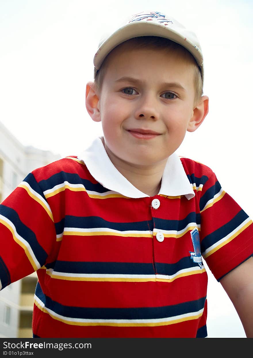 The boy plays in the street