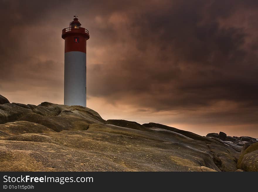 Umhlanga Lighthouse on the rocky coast of South Africa. Umhlanga Lighthouse on the rocky coast of South Africa