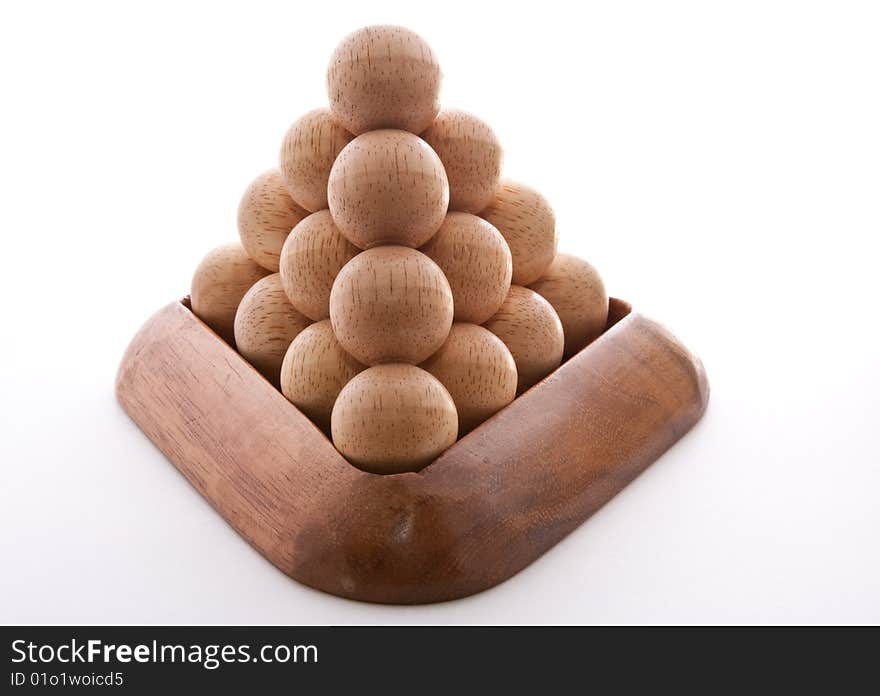 Wooden balls puzzle assembled on white background. Wooden balls puzzle assembled on white background