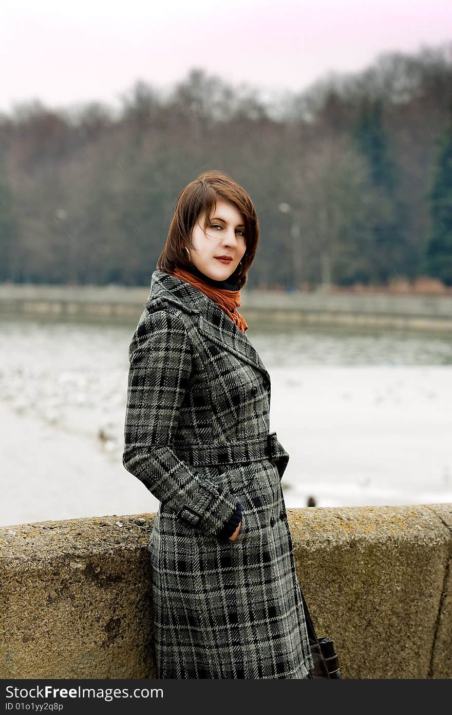 Dark Hair Girl Near River Bank