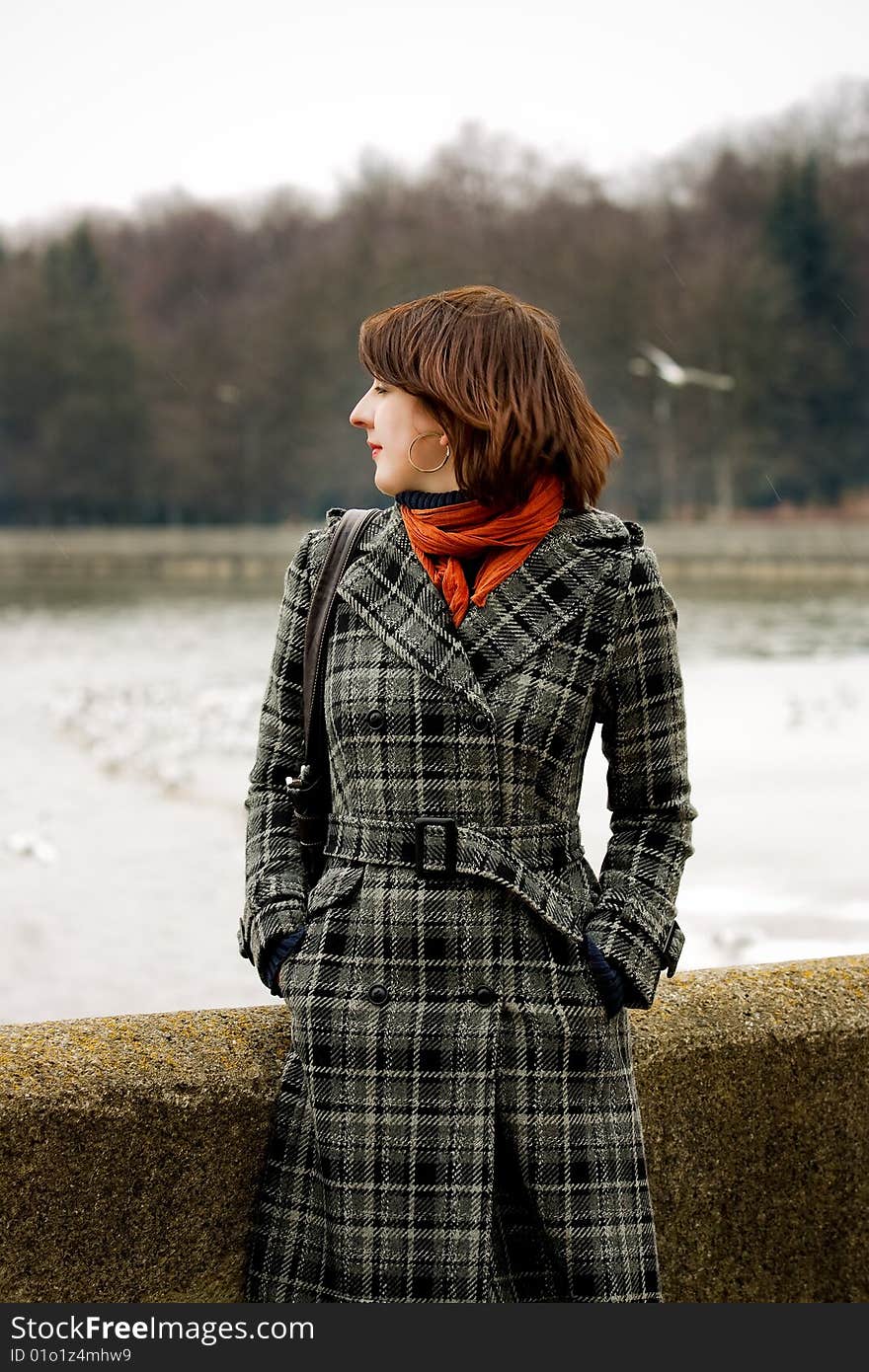 Young woman near river standing