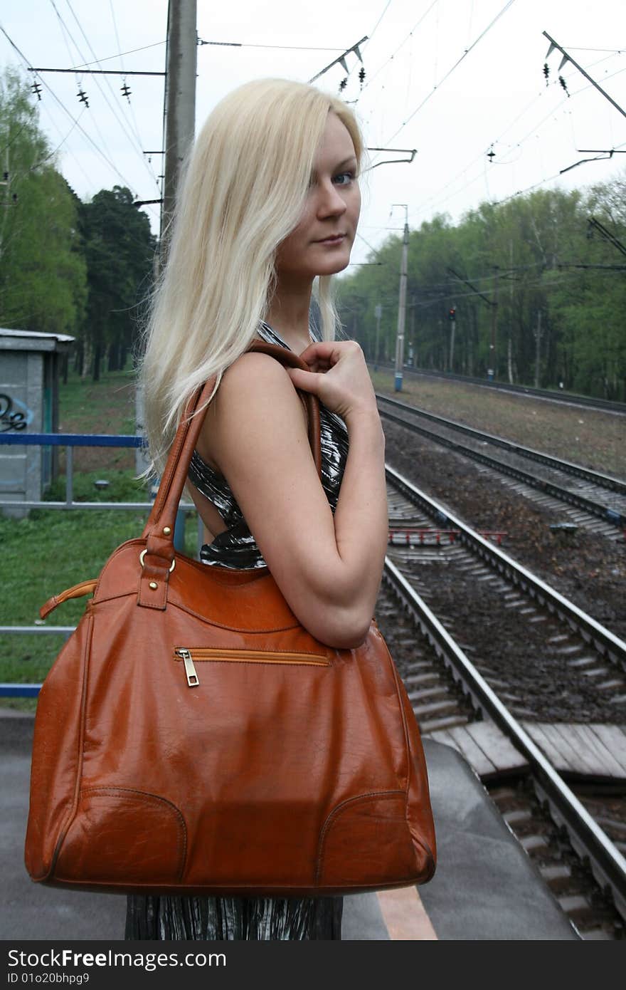 Smiling girl with a bag