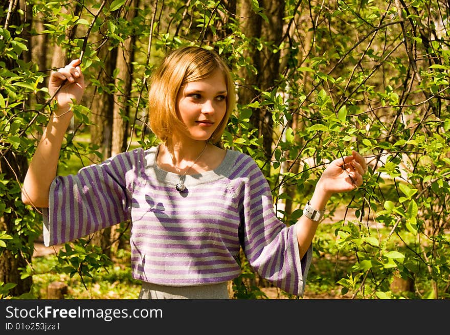 Portrait of young beautiful woman in the forest