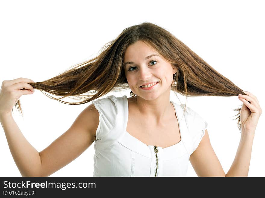 A beautiful young smiling woman with long brown hair posing on a white background