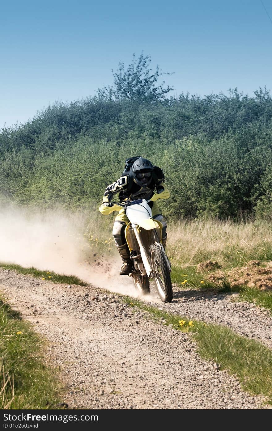 An enduro rider fast moving  on motocross.