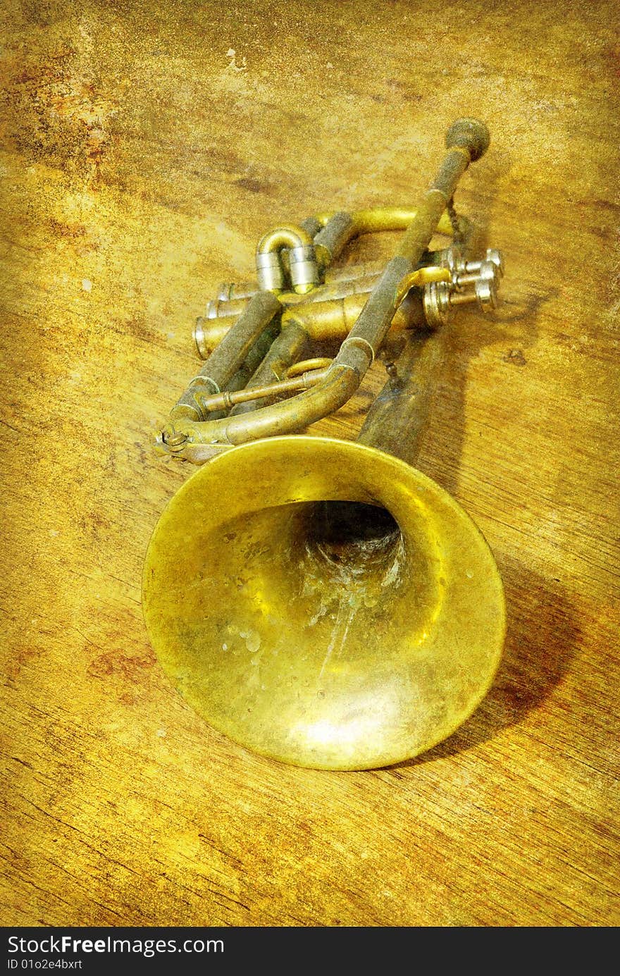 Trumpet in old grunge background